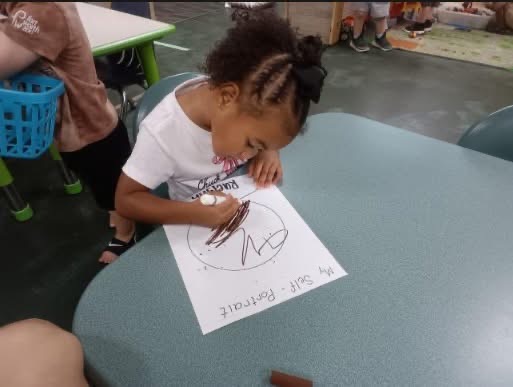 A child working on an art project at Amaze Academy