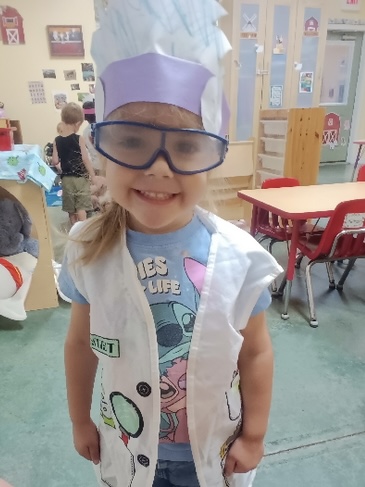 A young Amaze Academy learner dressed for a science activity